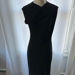Medium Zara asymmetrical black midi dress with draping throughout.